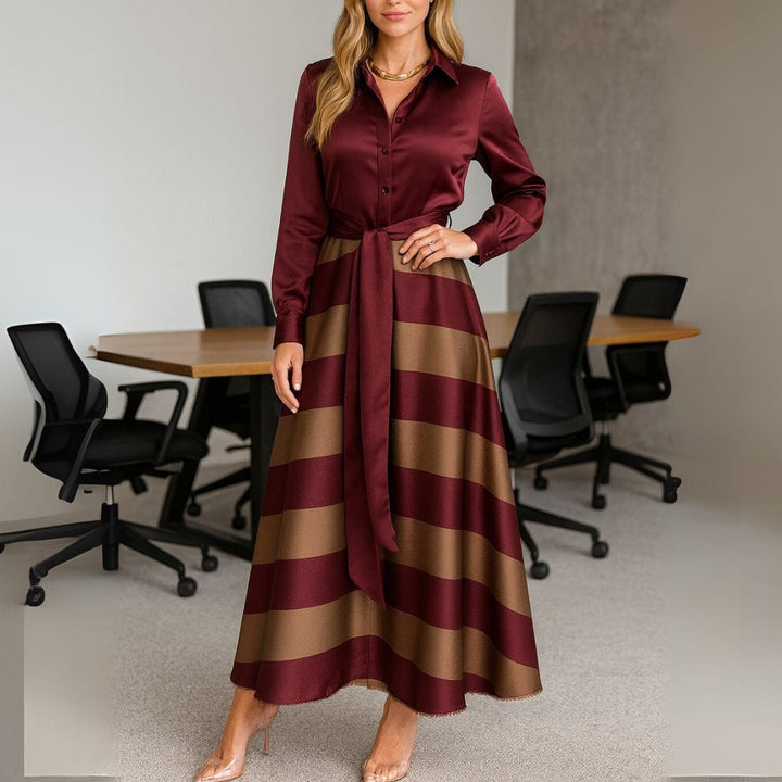 Front view of a model wearing the elegant retro striped party dress with long sleeves and a tie waist