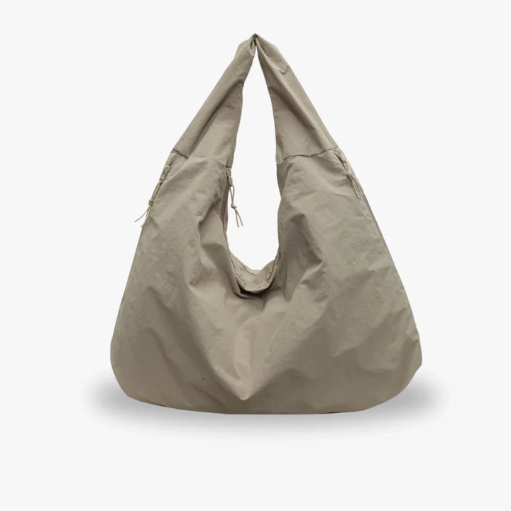 Khaki recycled nylon hobo bag with a slouchy shape and drawstring
