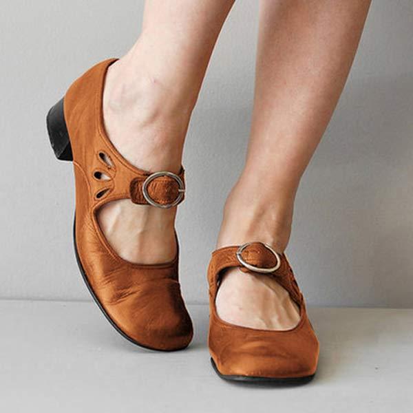 Front view of model wearing tan premium leather orthopedic comfort sandals with decorative cutouts and buckle
