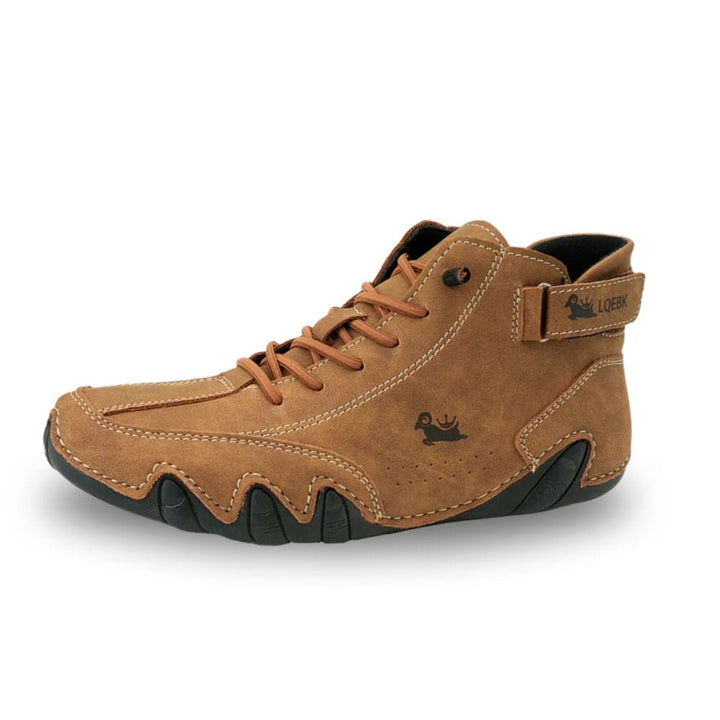 Three quarter view of a tan Orthopedic Comfort Boot with black anti-slip sole and laces