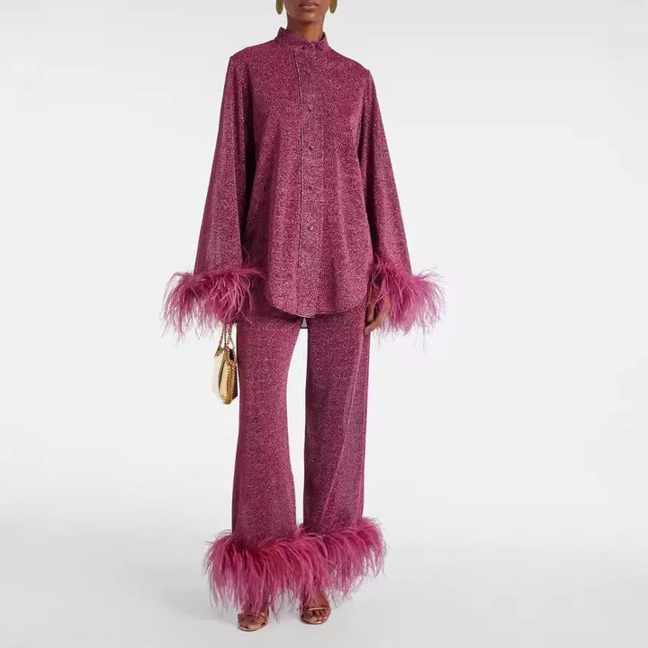Front view, model wearing a sparkling pink Leona two-piece set with feather cuffs and feather hems