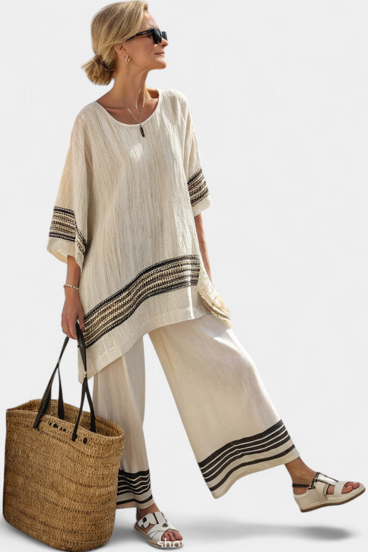 Off white two piece linen suit with striped hem trim, front view
