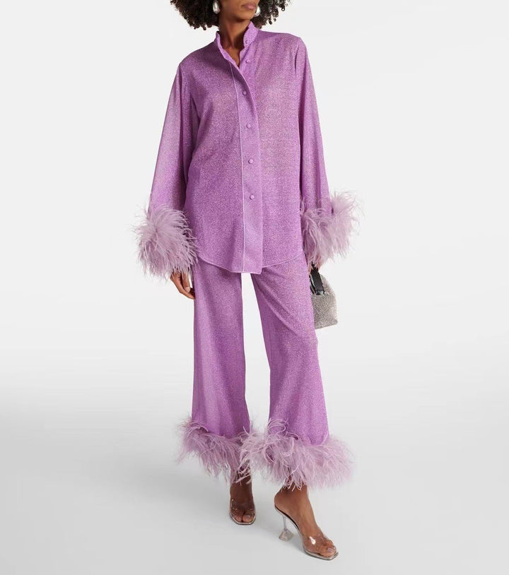 Front view, model wearing a sparkling lilac Leona two-piece set with feather cuffs and feather hems