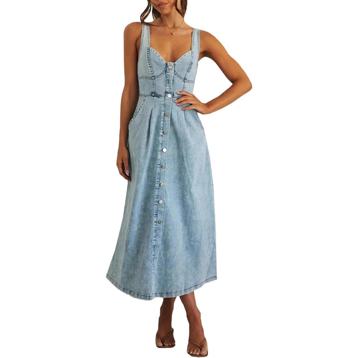 Front view of a model wearing a light blue classic sleeveless button-front denim dress with pockets
