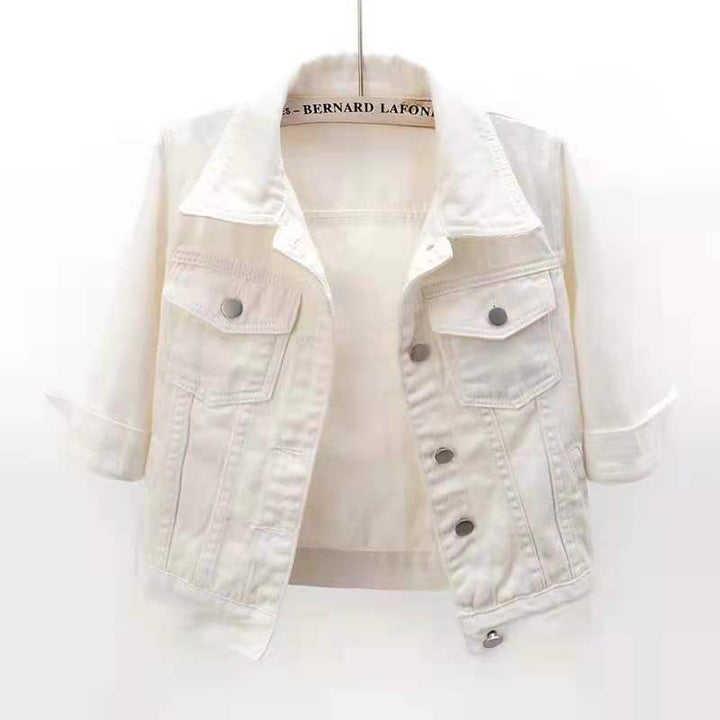Front view of a white colourful denim jacket with rolled up three quarter sleeves, on a hanger