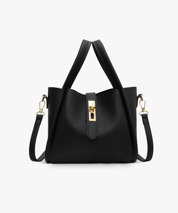 Front view of the Valeria vegan leather handbag in black with gold clasp and detachable shoulder strap