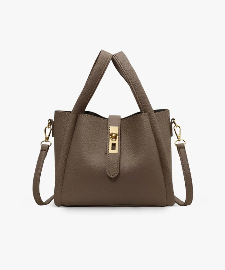Front view of the Valeria vegan leather handbag in a rich brown with gold hardware and top handles