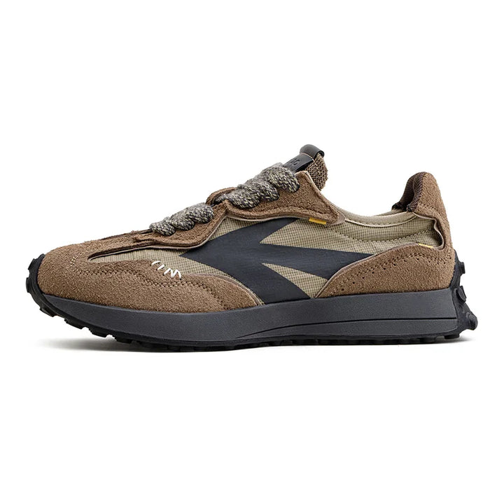 Side view of one Noah 70s retro suede sneaker in brown and olive on a white background