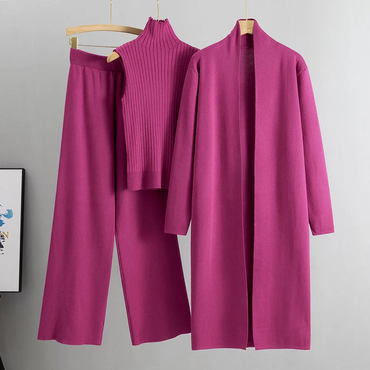 Flat lay of the magenta Ruby 3-piece knitted cardigan set with long cardigan, ribbed top, and wide leg pants