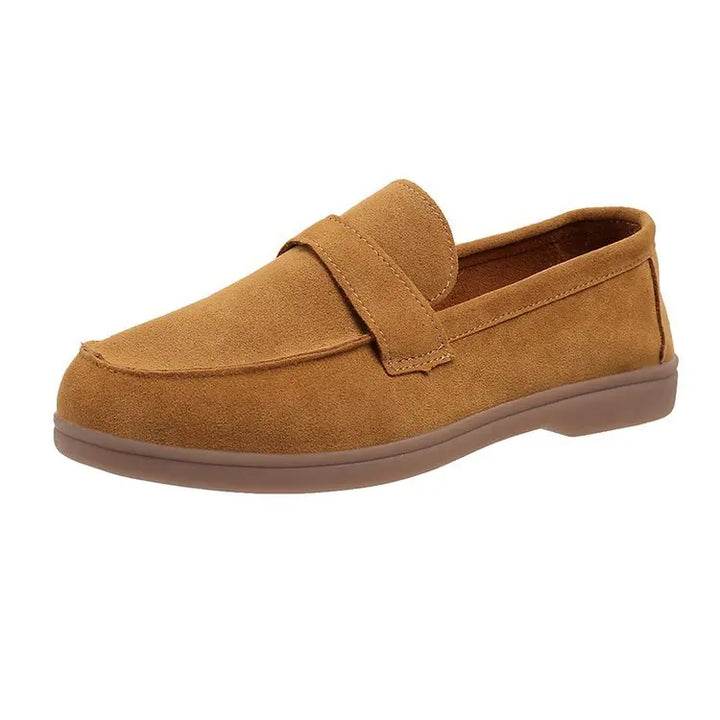 Front view of a single brown suede loafer with a brown sole on a white background