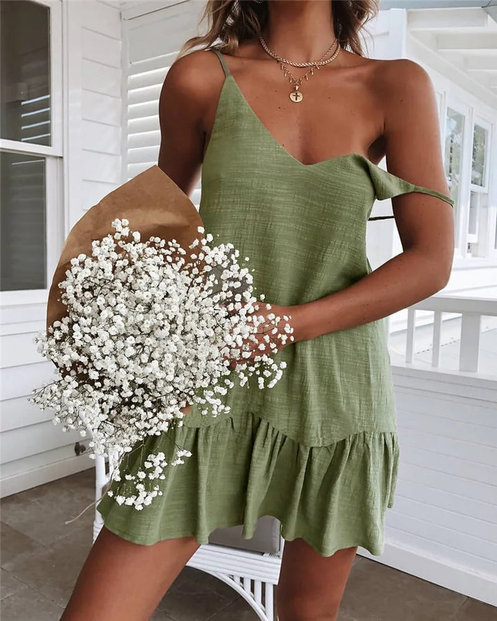 Off-Shoulder Mini Dress worn by model, close up, showing the olive green fabric and layered necklaces