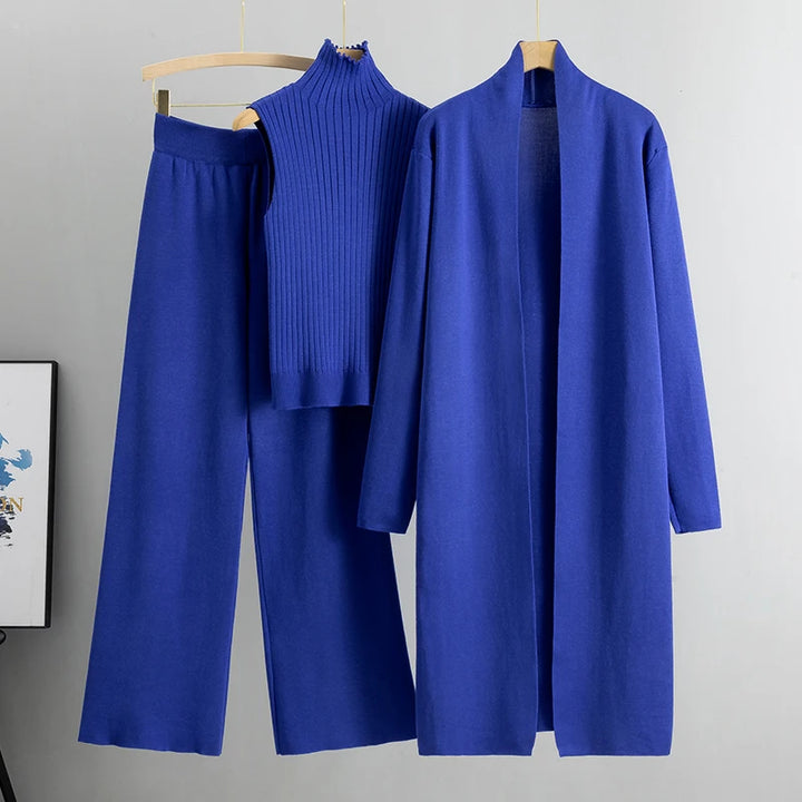 Flat lay of the blue Ruby 3-piece knitted cardigan set with long cardigan, ribbed top, and wide leg pants