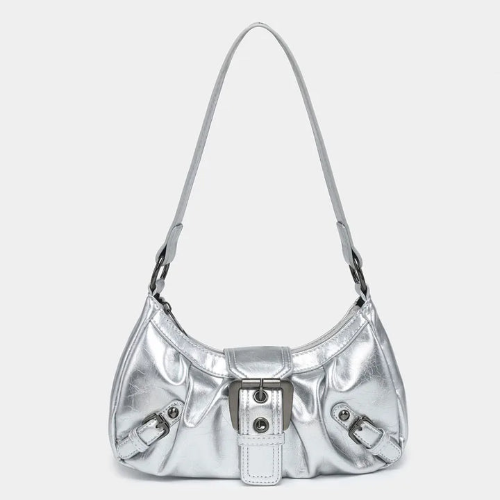 Front view of the Nola Retro Y2K Shoulder Bag, a shiny silver faux leather handbag with buckle details