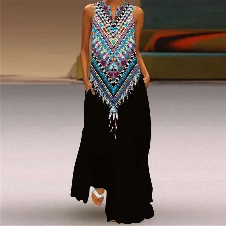 Front view worn by model, Butterfly Bloom A-Line Dress with a colourful geometric print top and black skirt