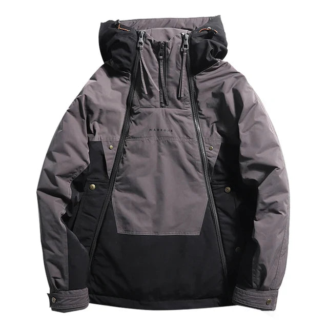 Front view of a grey and black bold colour block techwear jacket with a half zip and hood