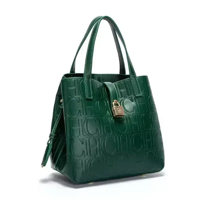Three quarter view of a green Kara Classic Large Bucket Handbag with embossed &