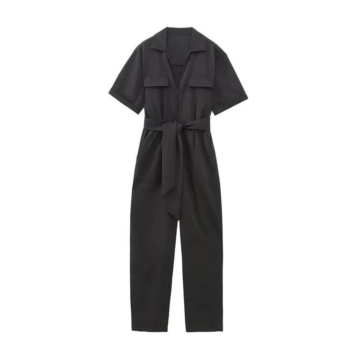 Flat lay of a black belted short sleeve zipper playsuit with a straight fit on a white background