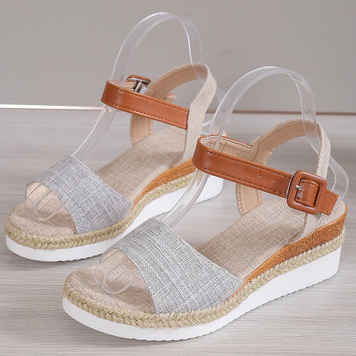 Front view of Vera Retro Wedge Sandals, showing the light grey toe strap and brown ankle strap with buckle