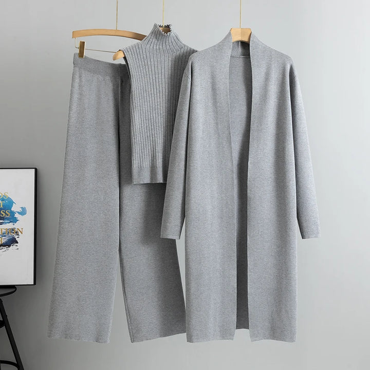 Flat lay of the grey Ruby 3-piece knitted cardigan set with long cardigan, ribbed top, and wide leg pants