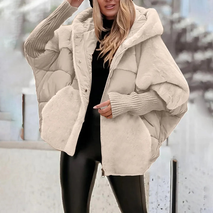Vera Faux Fur Hooded Winter Parka, front view worn by model, showing ribbed cuffs and faux fur pockets