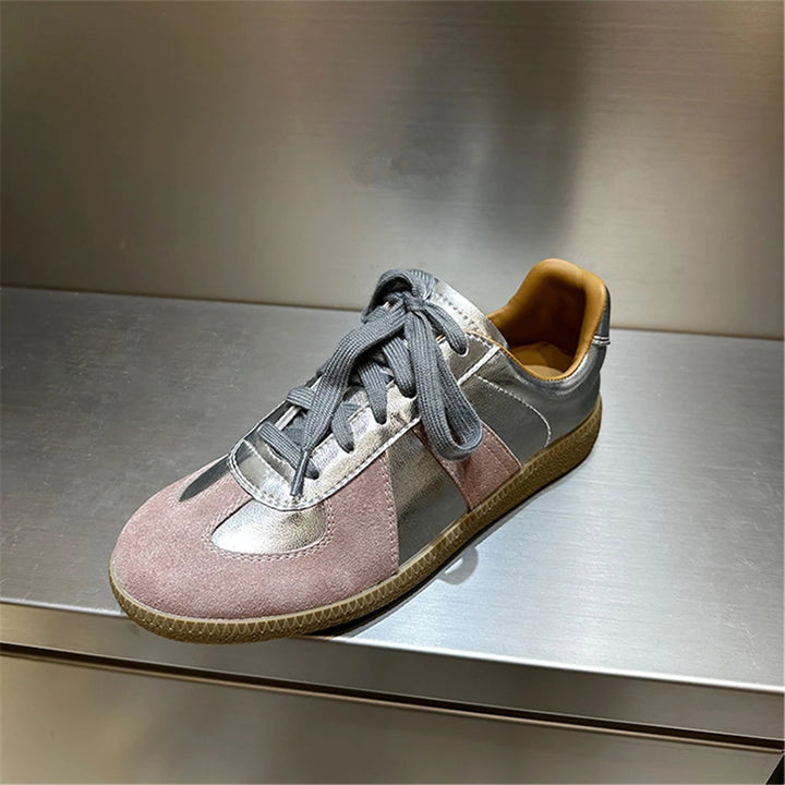 Three quarter view of a light purple Nova genuine leather sneaker with grey laces and a tan inner sole