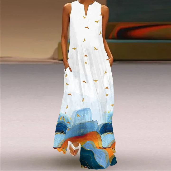 Front view of the Butterfly Bloom A-Line Dress with a white top and a blue and orange abstract print hem