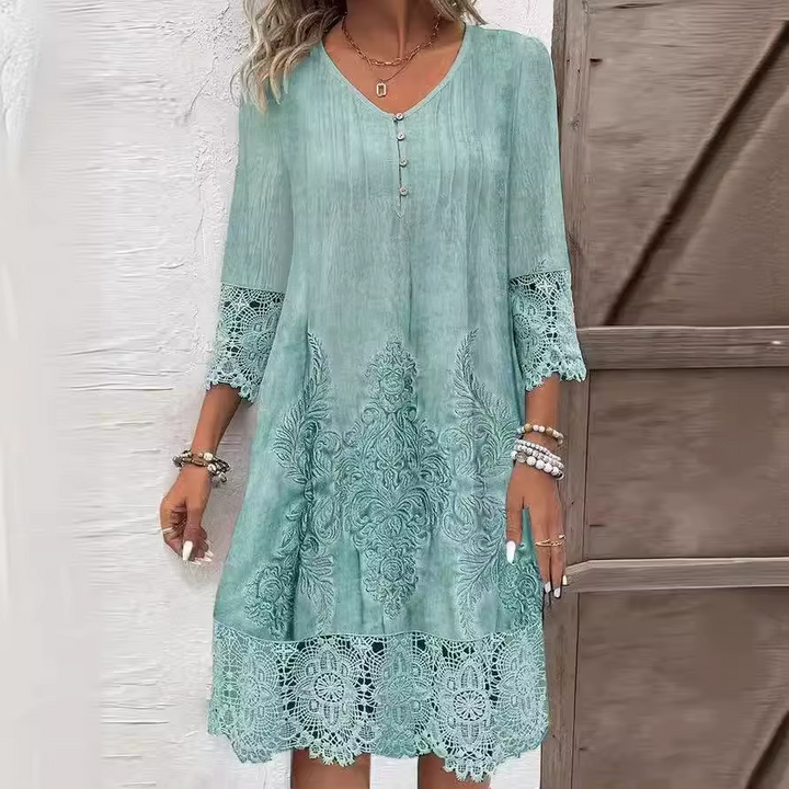 Front view of an elegant lace dress with a half-neckline and intricate lace patterns on the hem worn by a, alternate angle