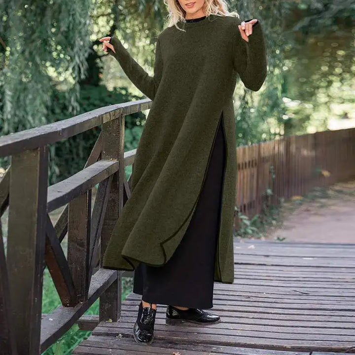 Front view, model in a green plus size vintage split midi sweatshirt dress on a wooden bridge