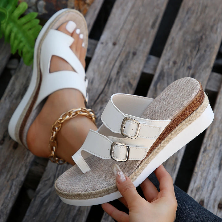 Isla Espadrille Wedge Slides, one worn by model with gold anklet, another held showing the side view