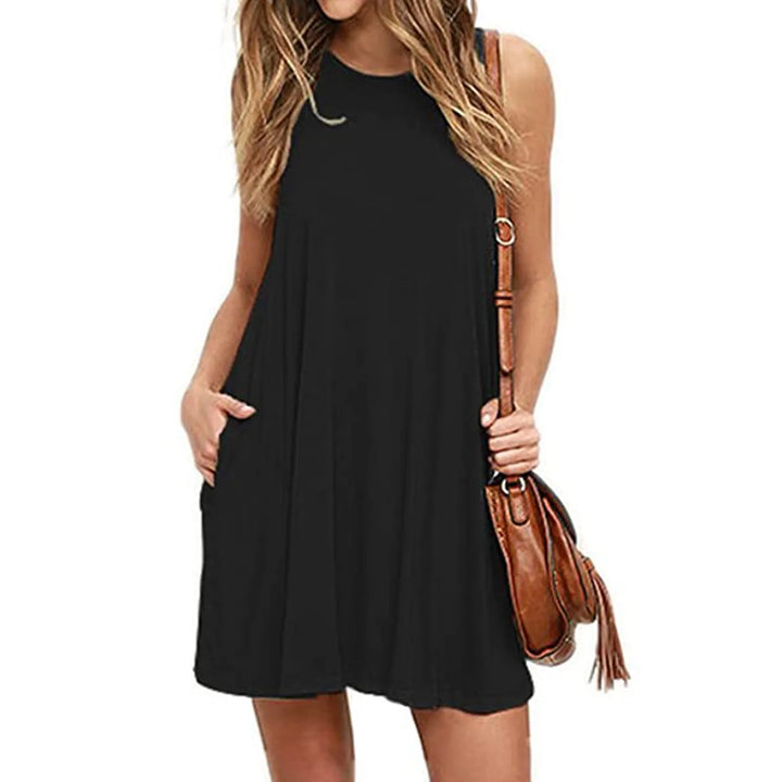 Front view worn by model of a black casual summer beach dress with a brown shoulder bag