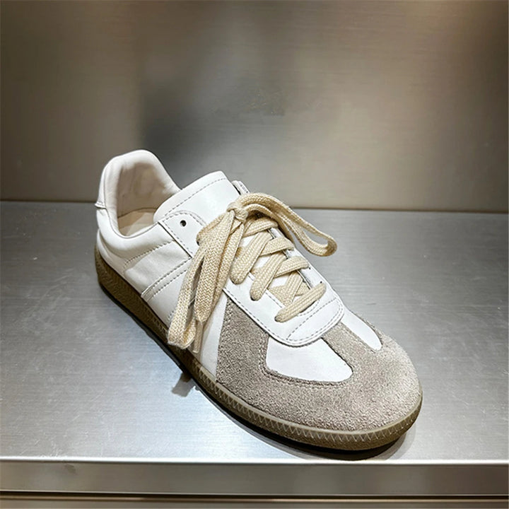 Close up view of the Nova genuine leather sneaker in light beige with suede toe and tan laces