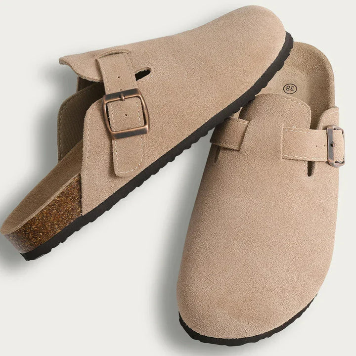 Pair of Aaron slip-on sandals, light beige suede with adjustable buckle straps and cork soles, flat lay