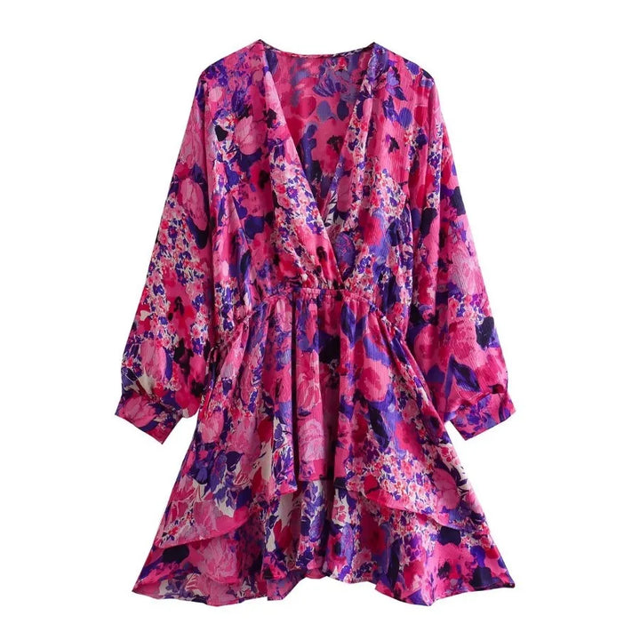 Elegant long-sleeve evening dress, front view, with a vibrant pink and purple floral print on a white background