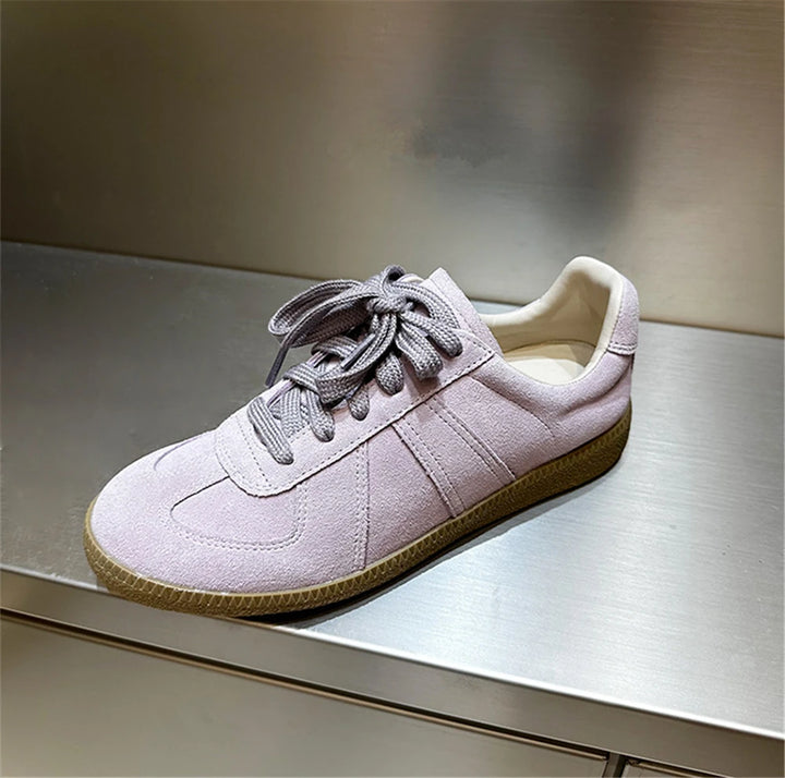 Front view of a light purple Nova genuine leather sneaker with grey laces and a tan sole