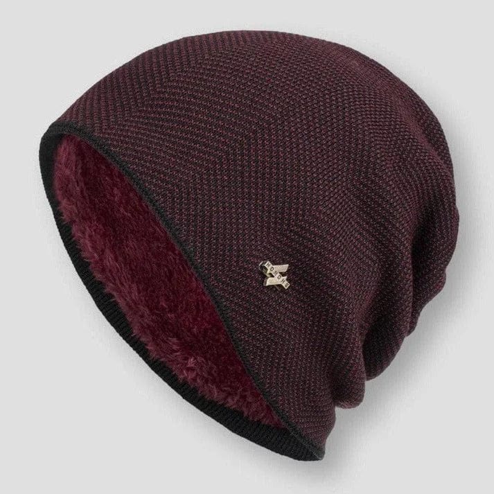 Three quarter view of the Classic Knitted Wool Beanie showing the maroon faux fur lining and chevron knit pattern