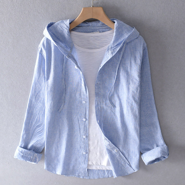 Front view of a blue and white striped linen blend hooded shirt, unbuttoned over a white tee
