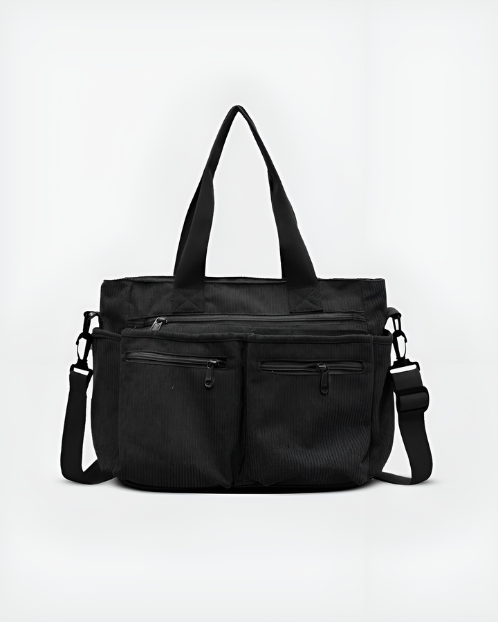 Front view of the Urban Cord Tote Bag in black corduroy with two top handles and a long adjustable shoulder strap