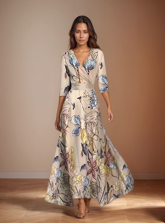 Front view, model wearing a beige floral print wrap dress with a v neck and three quarter sleeves