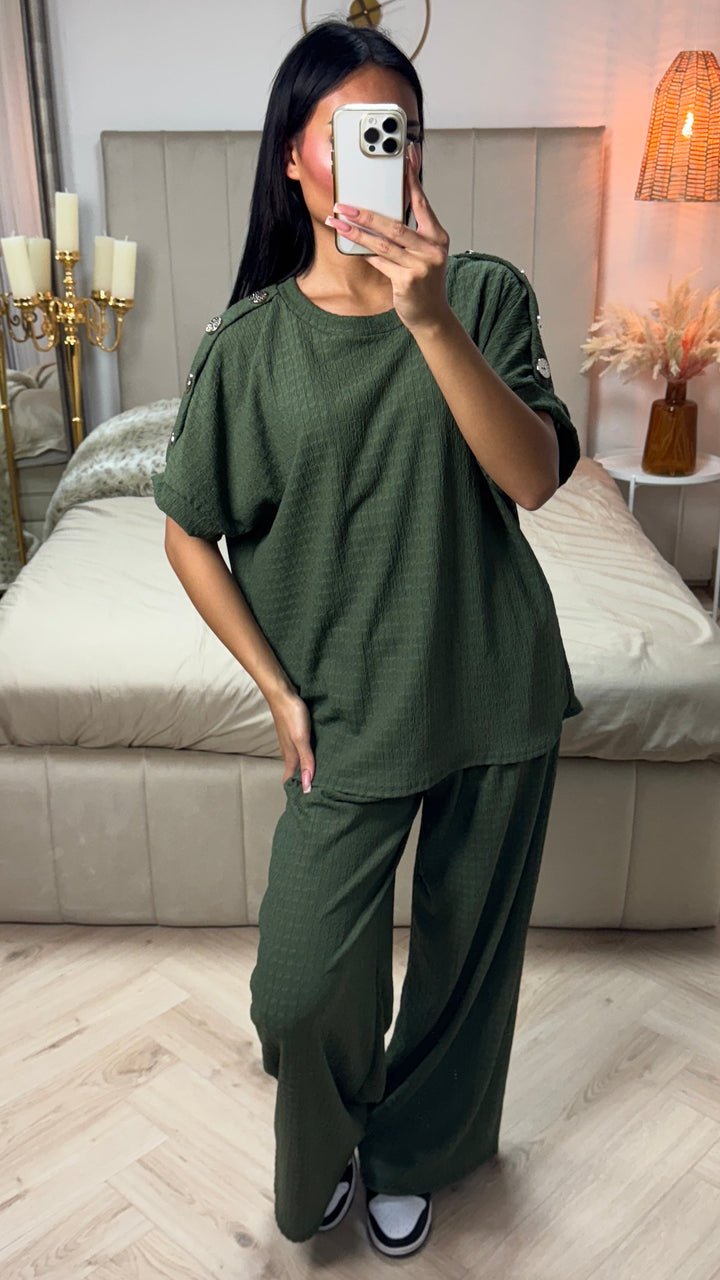 Oversized Viscose Set worn by model, front view. Olive green textured top with golden buttons and wide leg pants