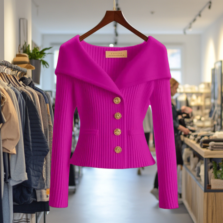 Front view of the magenta Priscilla Cardigan in premium knit, hanging in a boutique with other clothing