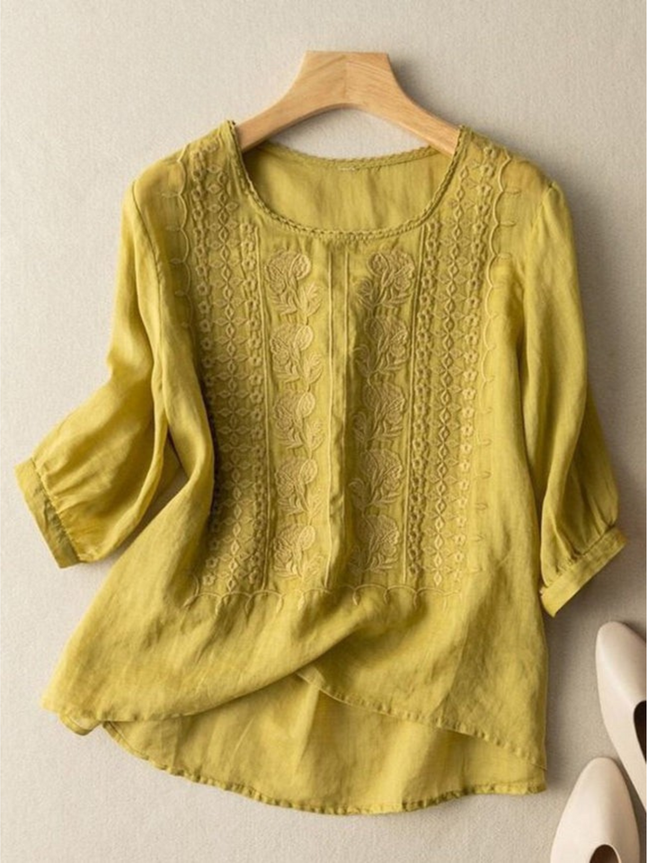 Chartreuse green mid sleeve cotton linen embroidery blouse on a hanger