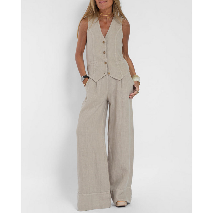Elegant vest and trousers two-piece set in natural linen, front view worn by model, with hands in pockets