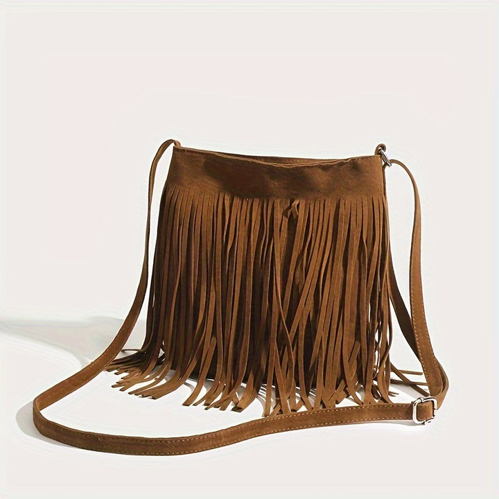 Side view of a brown boho fringe shoulder bag with long tassels and an adjustable strap buckle