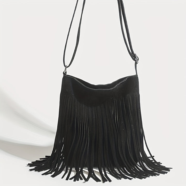 Front view of a black boho fringe shoulder bag with long tassels and an adjustable strap