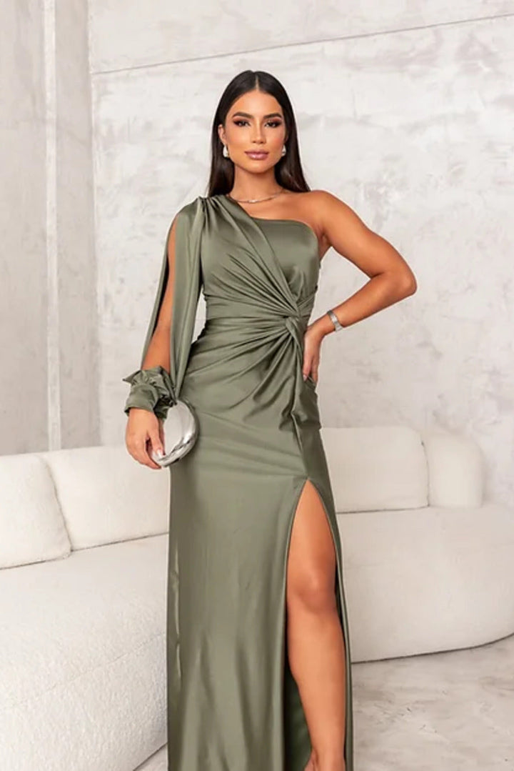 Elegant maxi dress worn by model, front view, one shoulder with flowing split sleeve detail, side split skirt