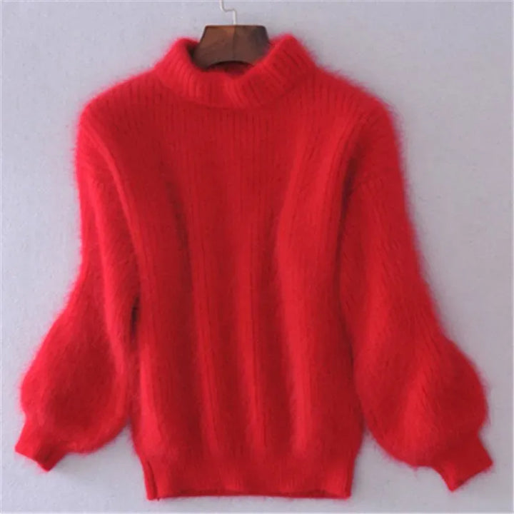 Front view of a red angora wool jumper with a ribbed high neck and voluminous sleeves on a hanger