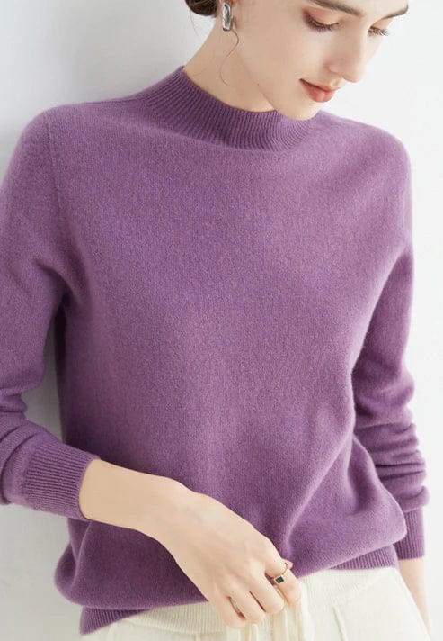 Close up, model wearing a lilac cashmere mock-neck jumper with ribbed collar and cuffs