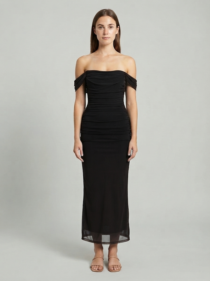 Black ruched mesh maxi dress with an off shoulder neckline, seen from the front