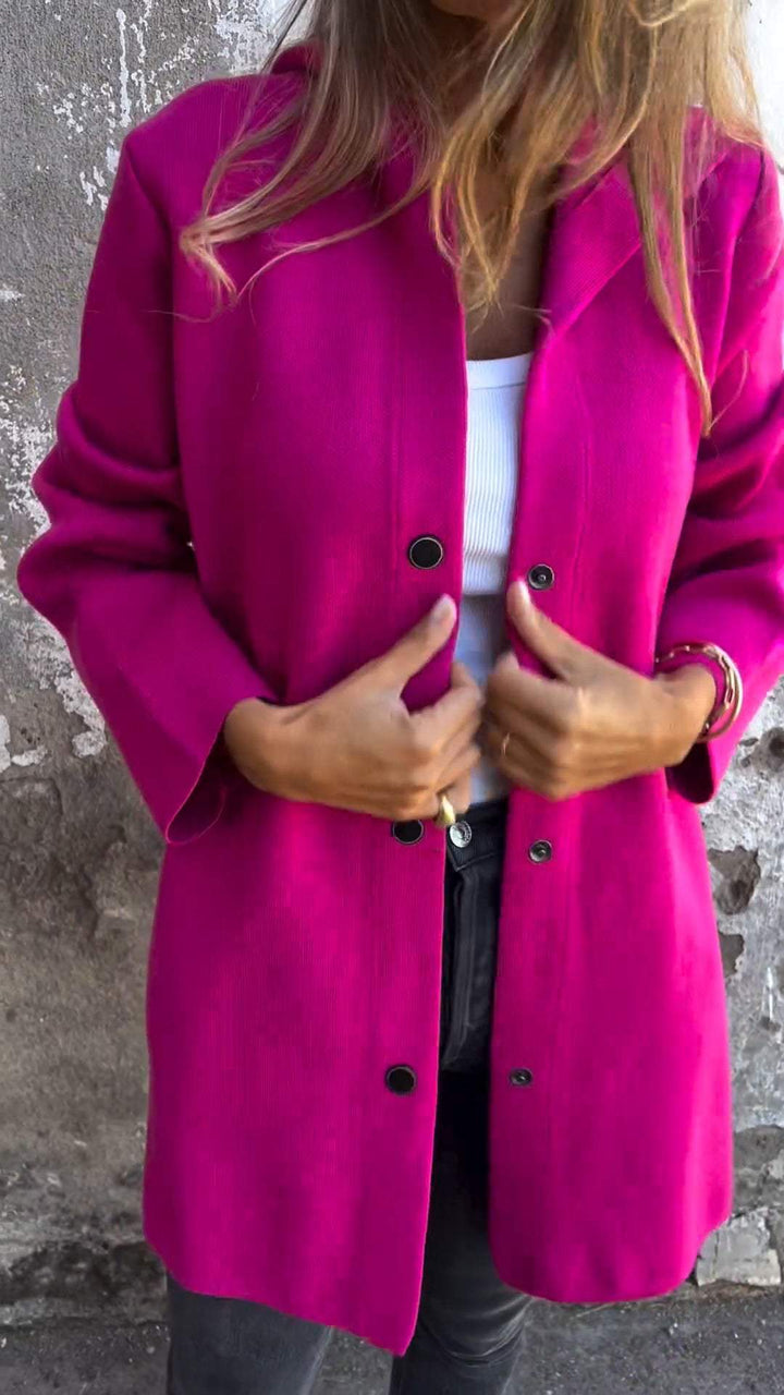 Fuchsia hooded casual jacket, front detail of the black buttons and hood