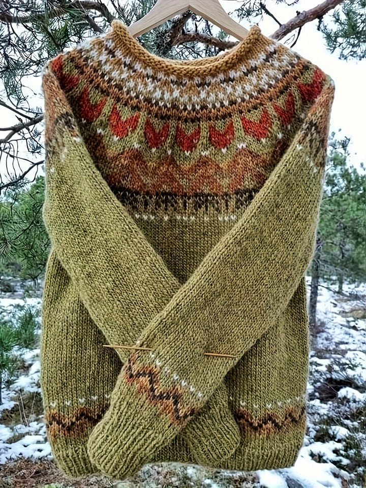 Elsa Geometric Knit Sweater front view, green jumper with rust and brown pattern on yoke and sleeves, outdoors